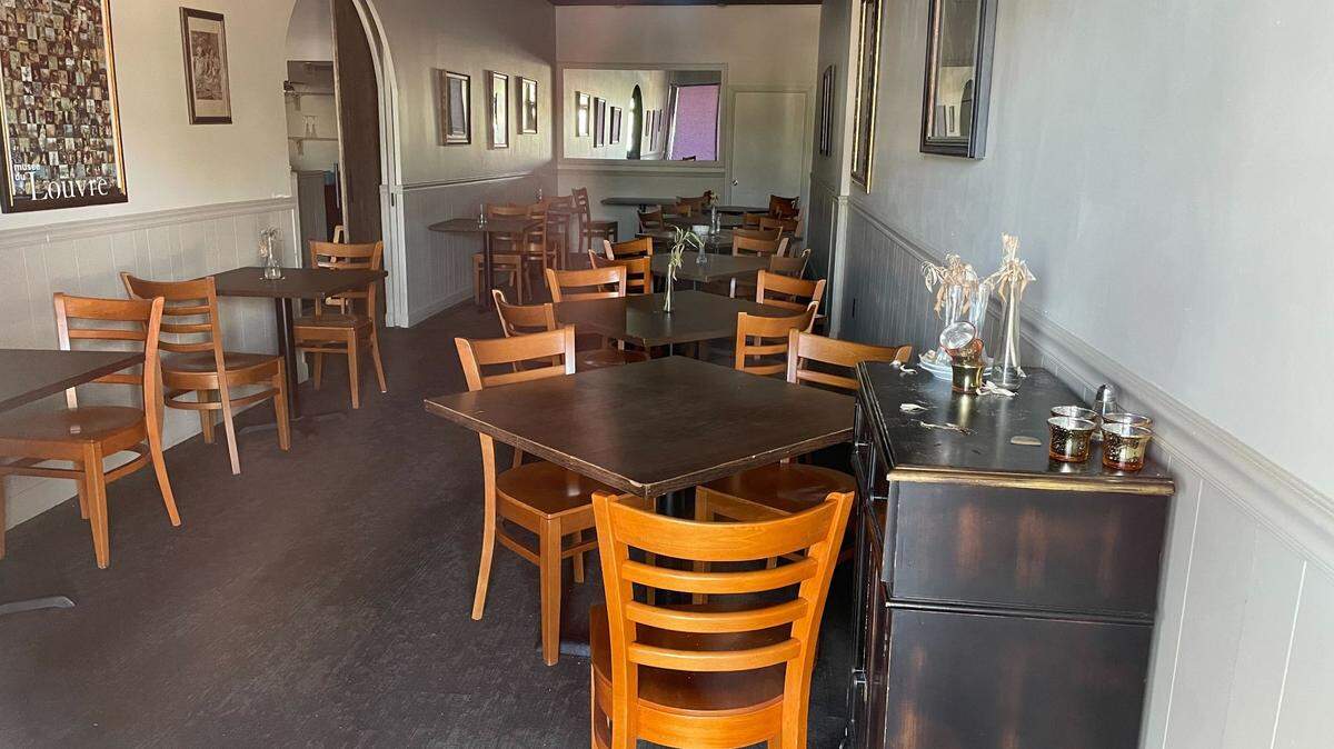 The dining room of North Raleigh’s Saint Jacques French Cuisine sits quietly after the restaurant closed earlier this summer.