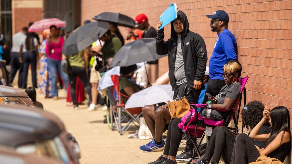 Dozens of people wait for hours outside the DMV office on New Bern Avenue in Raleigh on Tuesday, April 22, 2025. State lawmakers have described the Division of Motor Vehicles as “broken.”