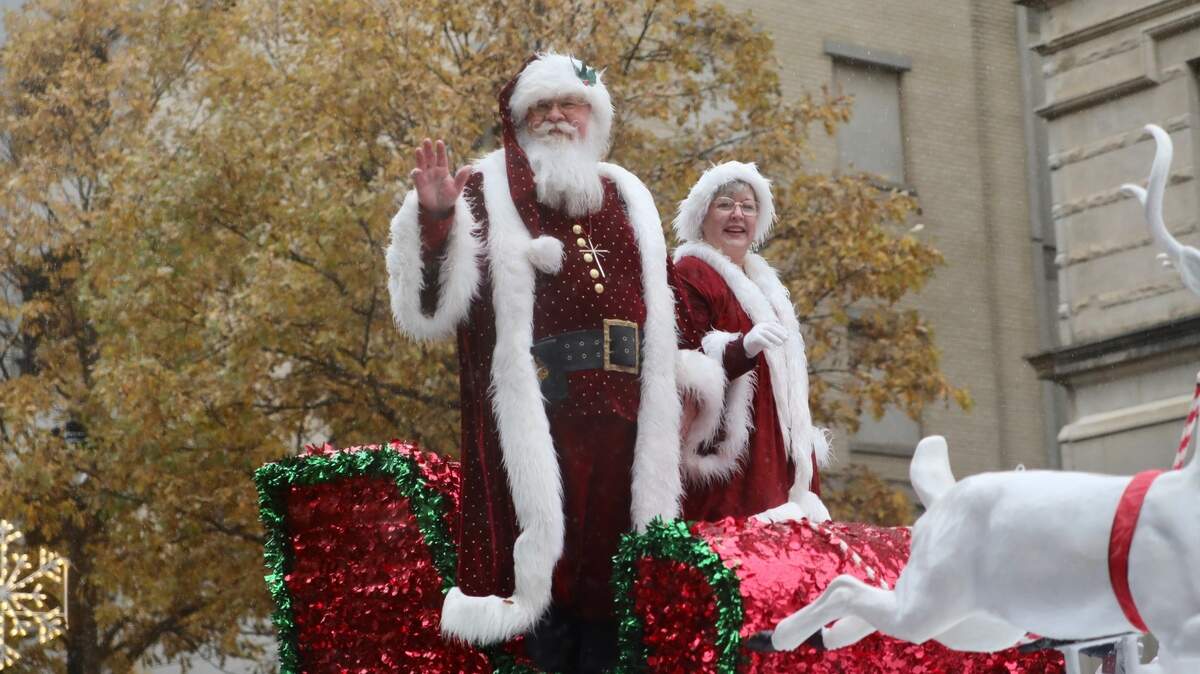Santa Claus and Mrs. Claus wave to the crowd during the Raleigh Christmas Parade in Raleigh, N.C. on November 23, 2019.