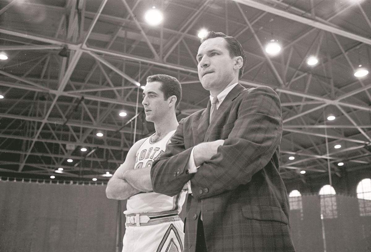 UNC coach Dean Smith, right, in Woolen Gym in 1962. Smith replaced Frank McGuire as head coach in the fall of 1961.