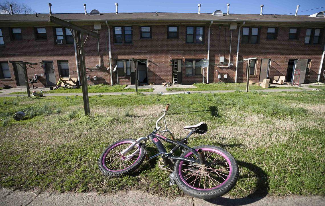More than 280 families have been living in hotels while their buildings in McDougald Terrace are renovated. A bicycle is shown outside one of the vacant buildings on Friday, February 14, 2020 at McDougald Terrace in Durham, N.C. Eight families were notified on Friday that they could move back into their renovated units.