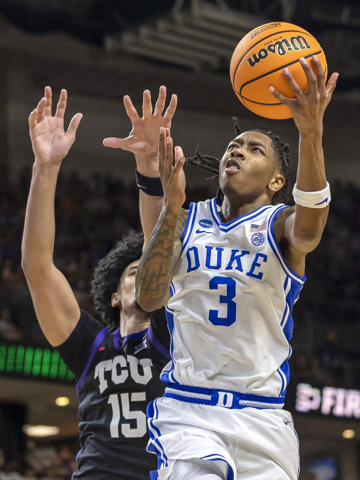 Duke forward Isaiah Evans (3) drives to the basket against  TCU forward David Punch (15) in the first half on Saturday, March 21, 2026, during the second round of the NCAA Tournament at Bon Secours Arena in Greenville, S.C.