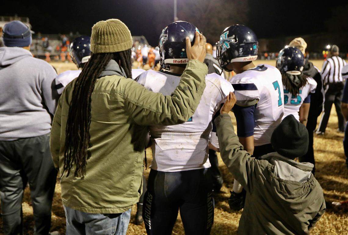 Na’Jae Newsome (4) stands with his brother and an assistant coach during Northampton County High School’s 20-12 victory over North Edgecombe High School in the semifinals of the North Carolina 1A High School Football Playoffs in Tarboro, N.C. on December 6, 2019.