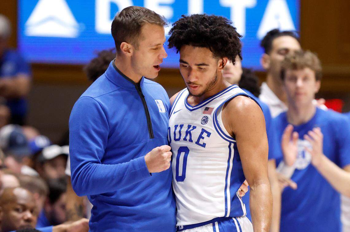 Duke head coach Jon Scheyer talks with Jared McCain (0) during the first half of Duke’s game against Charlotte at Cameron Indoor Stadium in Durham, N.C., Saturday, Dec. 9, 2023.