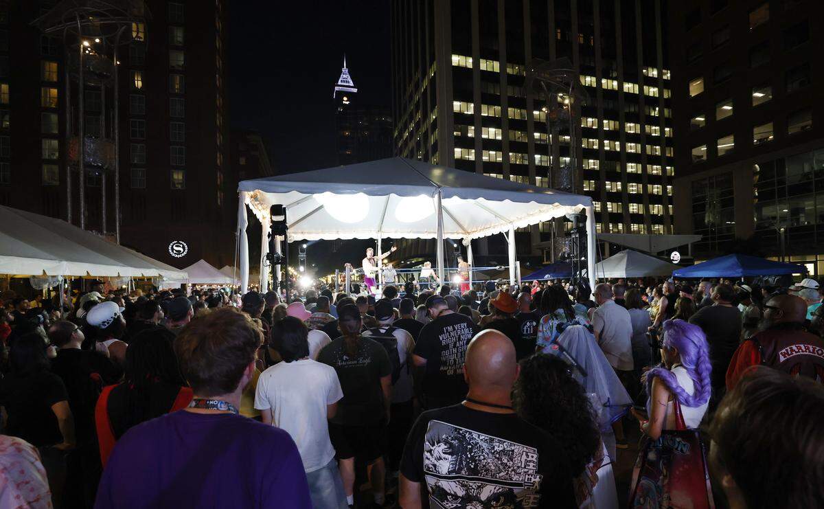 Spectators watch wrestling on Fayetteville St. during the GalaxyCon Raleigh Street Fest in downtown Raleigh Saturday, July 26, 2025.