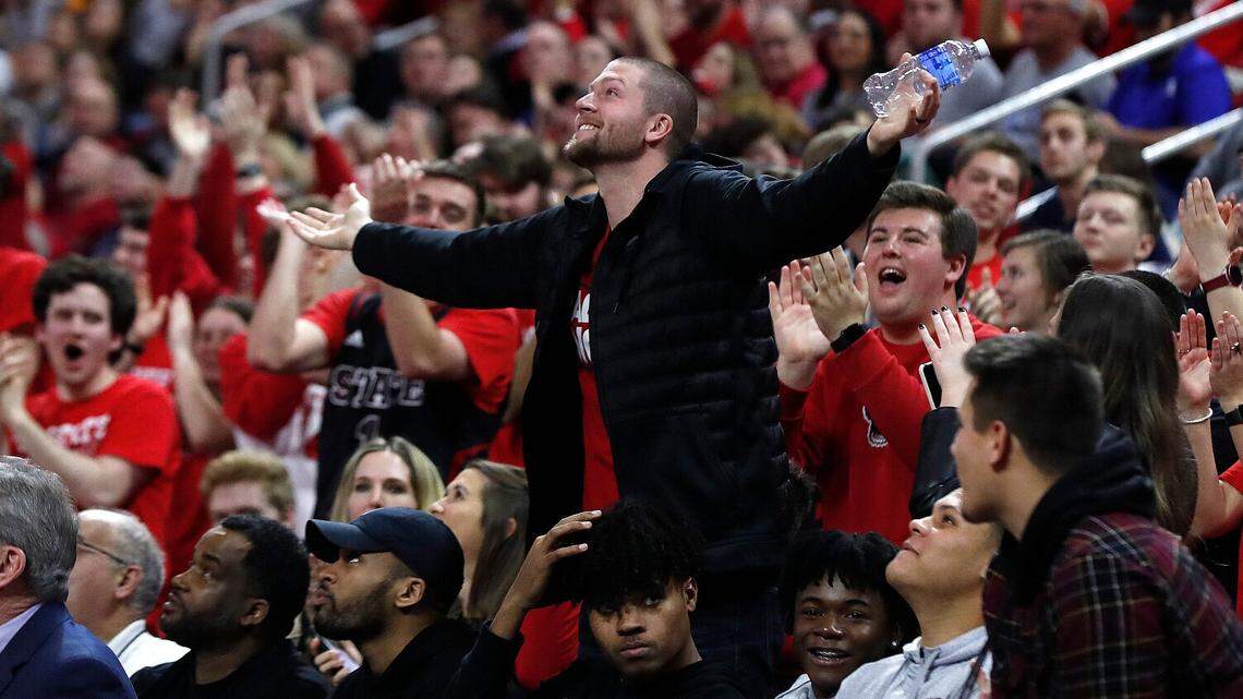 Former N.C. State player Scott Wood acknowledges the crowd during the second half of N.C. State’s 88-66 victory over Duke at PNC Arena in Raleigh, N.C., Wednesday, Feb. 19, 2020.
