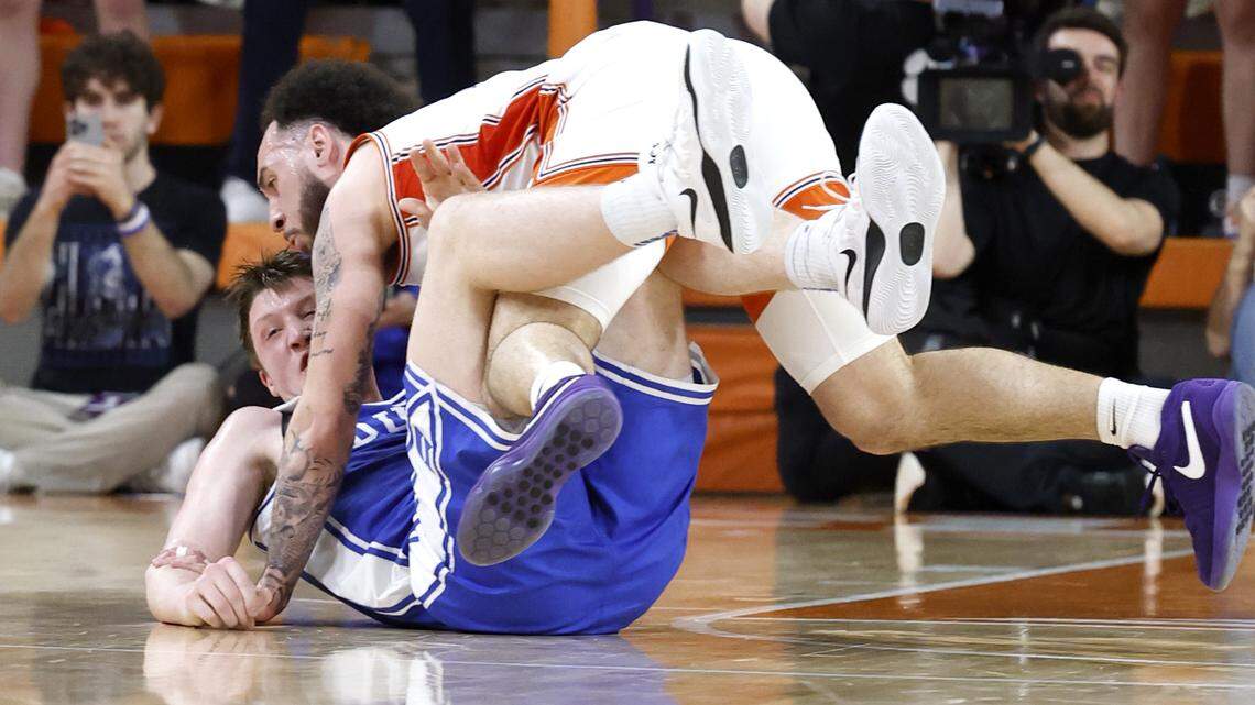 Duke’s Kon Knueppel (7) tangles with Clemson’s Jaeden Zackery (11) during the first half of Duke’s game against Clemson at Littlejohn Coliseum in Clemson, S.C., Saturday, Feb. 8, 2025. Knueppel would be called for a flagrant one for tripping Zackery seconds later.