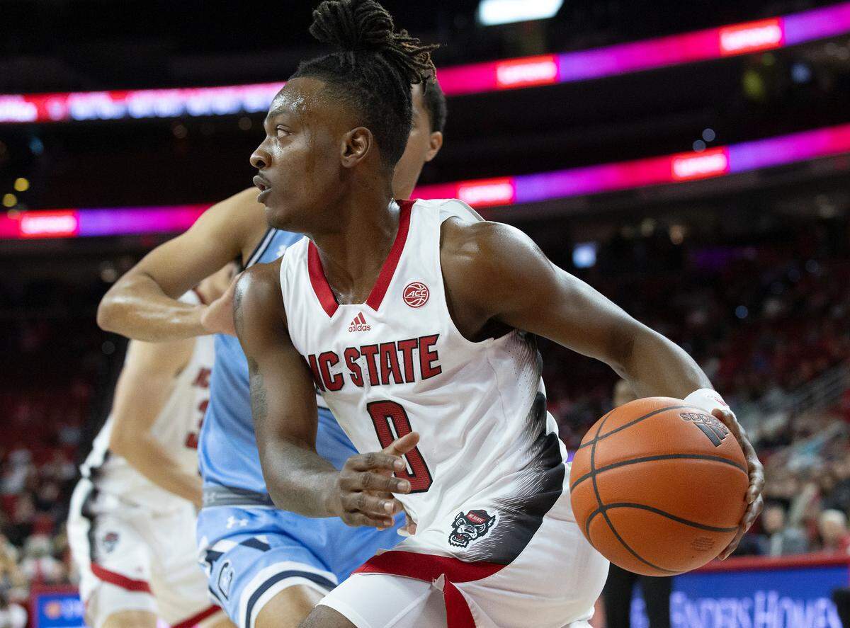 N.C. State’s DJ Horne drives past The Citadel’s Keynan Davis during the first half of the Wolfpack’s 72-59 win on Monday, Nov. 6, 2023, at PNC Arena in Raleigh, N.C.