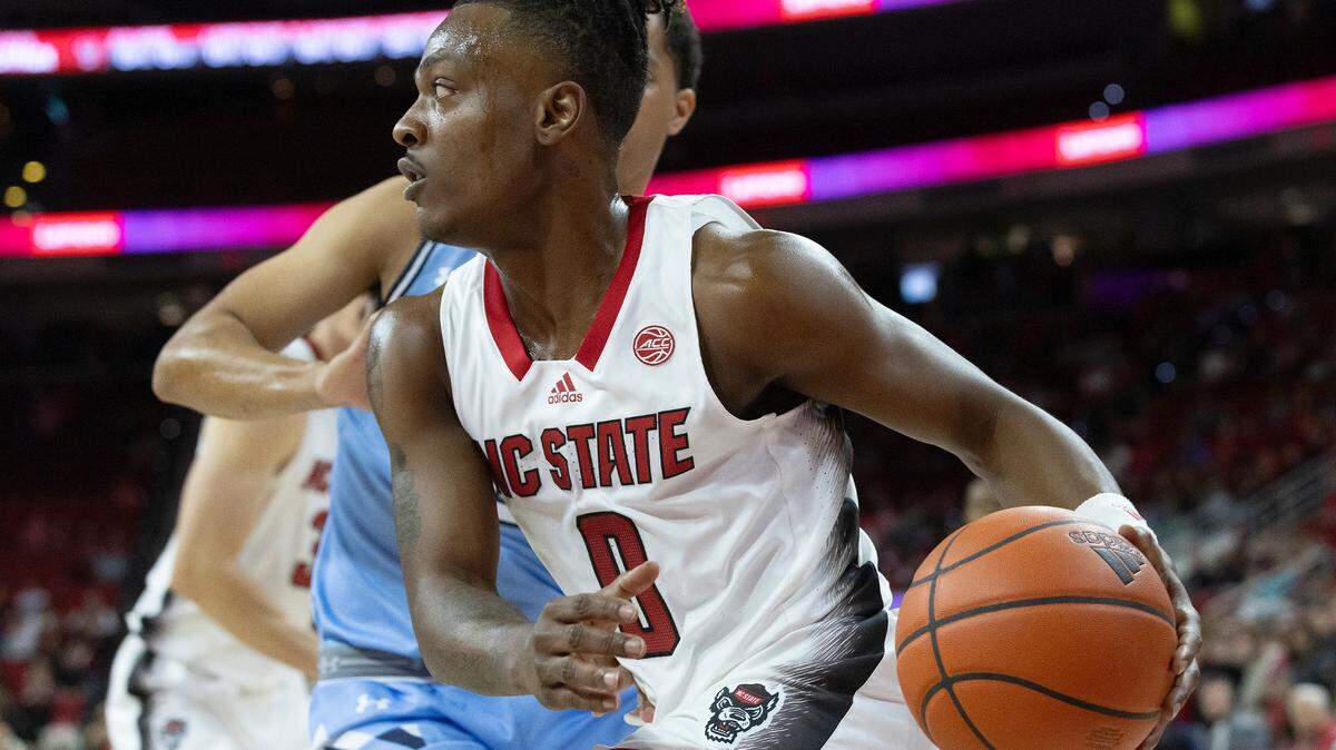 N.C. State’s DJ Horne drives past The Citadel’s Keynan Davis during the Wolfpack’s game on Monday, Nov. 6, 2023, at PNC Arena in Raleigh, N.C. On Friday, Horne had 18 points to lead N.C. State past Charleston Southern.
