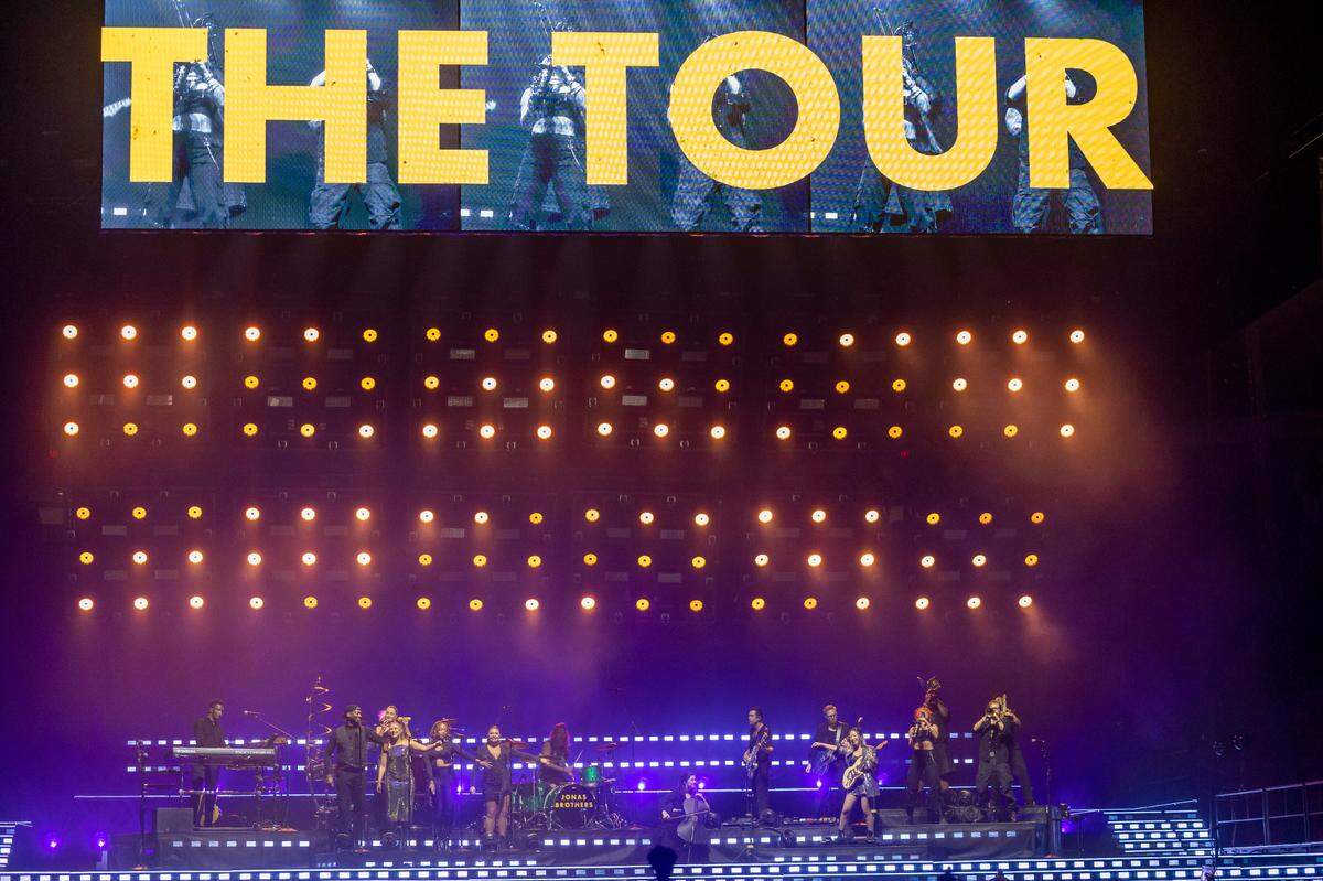 The stage lights illuminate the Jonas Brothers’ band as they await the arrival of Kevin, Joe and Nick Jonas for their show at the PNC Arena on Thursday, September 28, 2023 in Raleigh, N.C.