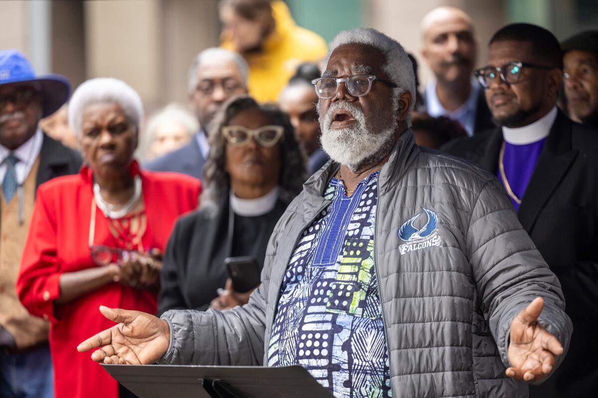 Harold Mallette, a 1981 St. Augustine’s University graduate, speaks out for more favorable terms on a multi-million dollar loan for the struggling historically Black university during a rally at City Plaza in Raleigh on Wednesday, Nov. 20, 2024. The event was organized by dozens of clergy members, civil rights activists, and university alumni.