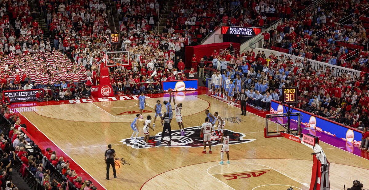 North Carolina’s Armando Bacot (5) goes up against N.C. State’s Dennis Parker Jr. (11) for the opening tip off on Wednesday, January 10, 2024 at PNC Arena in Raleigh, N.C.