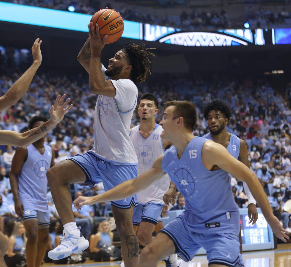 North Carolina’s R.J. Davis (4) drives to the basket during the scrimmage at the annual Carolina Basketball Late Night Event on Friday, October 15, 2021 at the Smith Center in Chapel Hill, N.C.