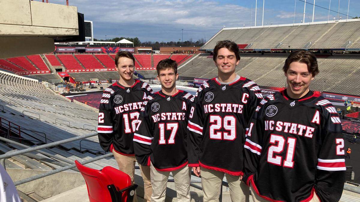NC State Icepack captain Victor Hugo (29) and alternate captains Matt Miller (12), Garrett Auriene (17) and Alex Robinson (21) at Carter-Finley Stadium.