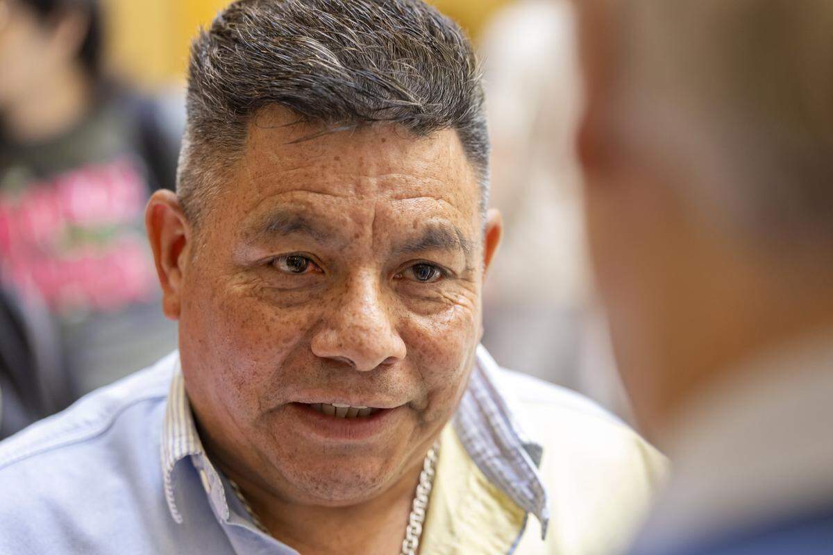 Duke University bus driver Luis Alonso Juárez talks with Rep. Marcia Morey of Durham during a visit to the General Assembly to deliver letters to House Speaker Destin Hall and Senate leader Phil Berger on Thursday, Sept. 4, 2025, in Raleigh. Juárez, is a Honduran immigrant who could face deportation. 