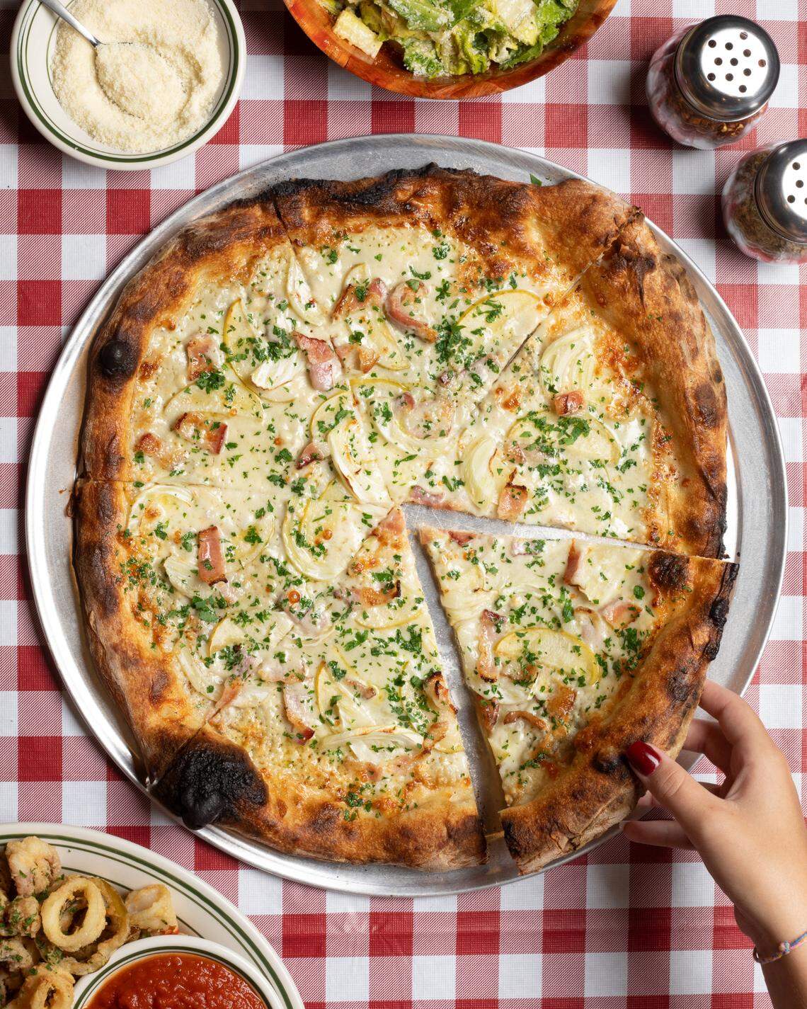 The pizza at Dino’s is blend of New York and Neapolitan styles. 