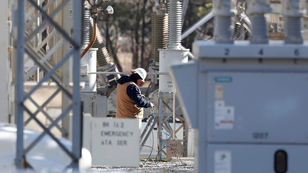 Crews work at an energy substation on Thursday, Jan. 18, 2024, in Durham, N.C. 