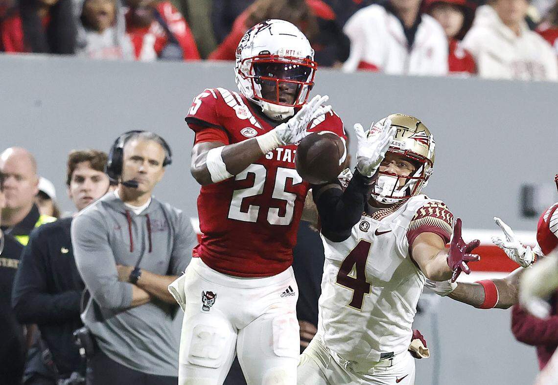 N.C. State cornerback Shyheim Battle (25) intercepts the ball intended for Florida State wide receiver Mycah Pittman (4) during the second half of N.C. State’s 19-17 victory over Florida State at Carter-Finley Stadium in Raleigh, N.C., Saturday, Oct. 8, 2022.