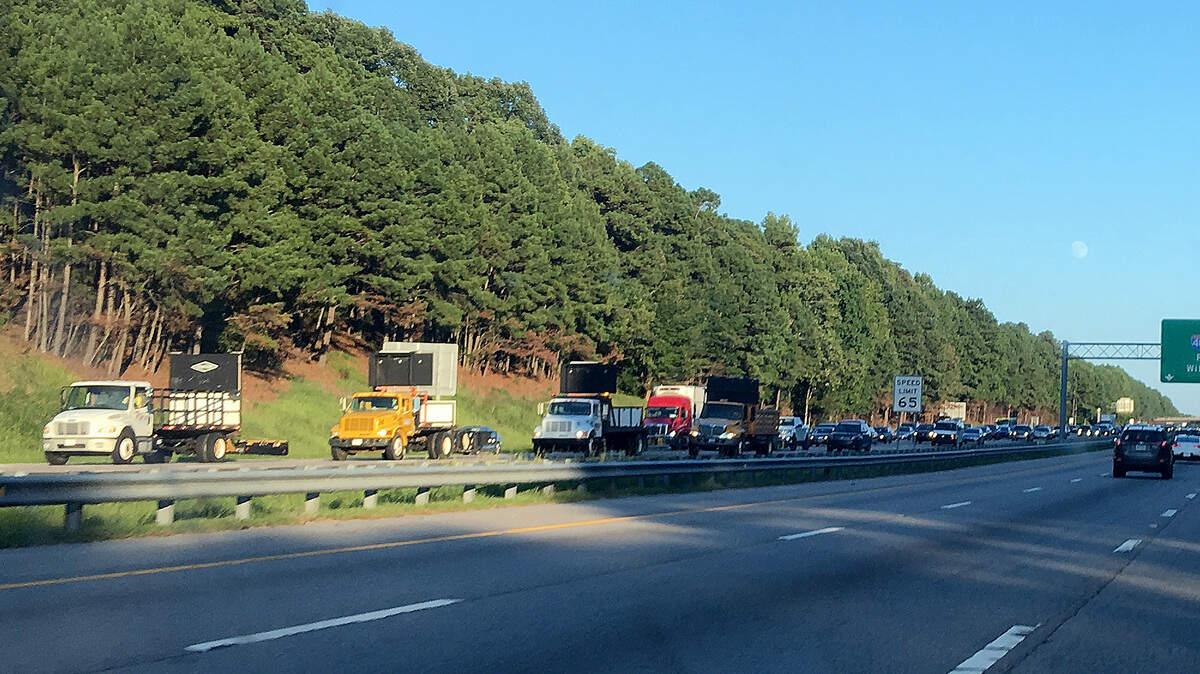 This is what a rolling roadblock looks like. This photo was taken on Interstate 40 on Aug. 23, 2018, during the first week of blasting work at the Aviation Parkway interchange.