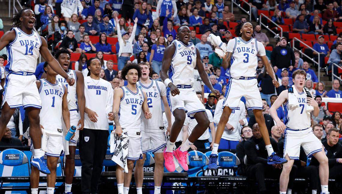 The Duke bench celebrates after Darren Harris slammed in two during the second half of Duke’s 93-49 victory over Mount St. Mary’s in the first round of the 2025 NCAA Men’s Basketball Tournament at the Lenovo Center in Raleigh, N.C., Friday, March 21, 2025.