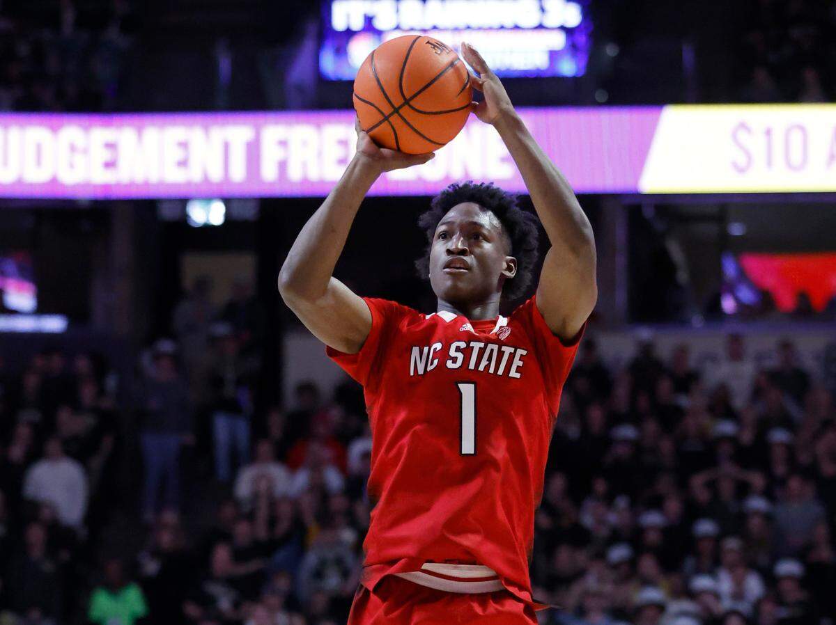 N.C. State’s Jarkel Joiner (1) makes a third-pointer at the end of the first half of N.C. State’s game against Wake Forest at Joel Coliseum in Winston-Salem, N.C., Saturday, Jan. 28, 2023.