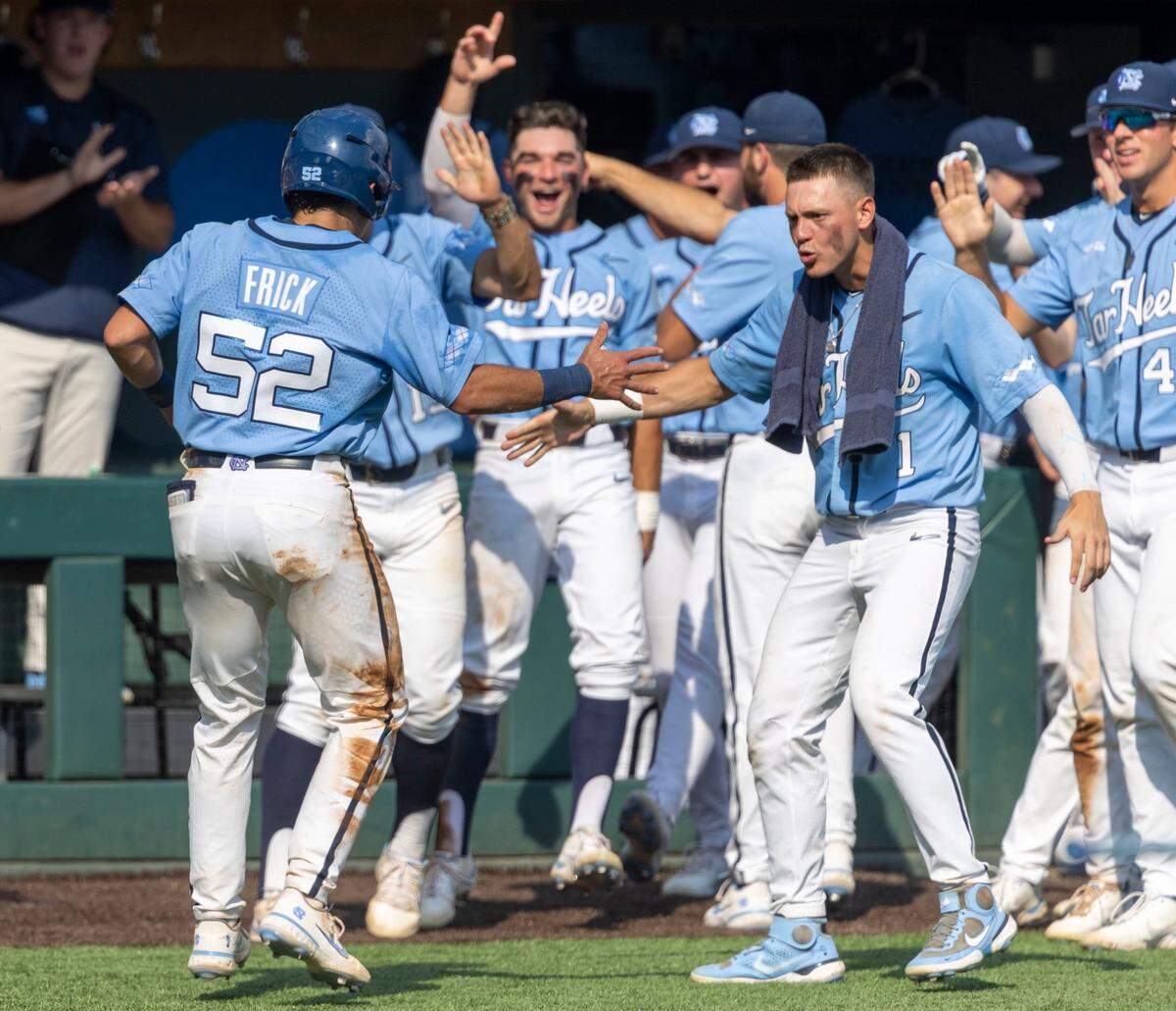 North Carolinas Danny Serretti (1) greets Tomas Frick (52) after he scored on a wild pitch by Arkansas pitcher Brady Tygart (25) in the seventh inning to tie Arkansas 2-2 in game two of their NCAA Super Regional series on Sunday, June 12, 2022 at Boshamer Stadium in Chapel Hill, N.C.