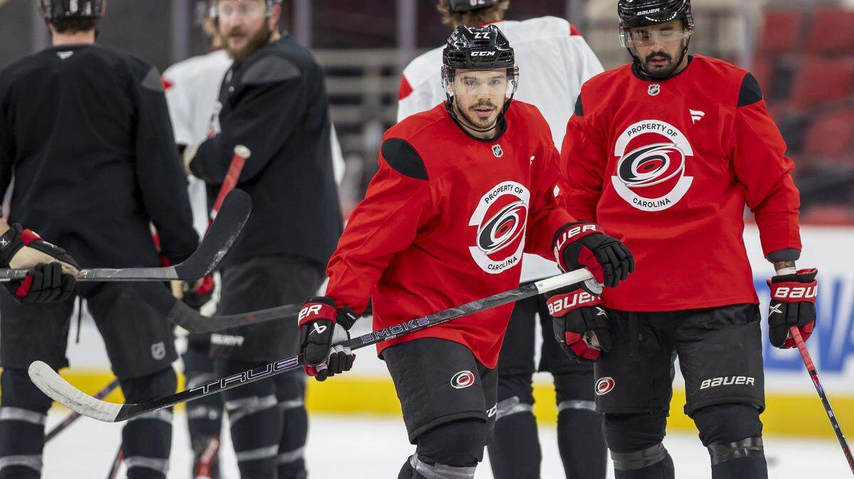 Carolina Hurricanes centers Logan Stankoven (22) and Seth Jarvis (24) take to the ice for their practice on Tuesday, May 12, 2026, at Lenovo Center in Raleigh, N.C.
