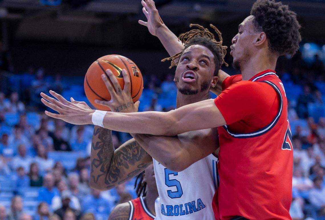 North Carolina’s Armando Bacot (5) muscles his way to the basket against Radford’s D’Auntray Pierce (21) in the first half on Monday, November 6, 2023 at the Dean Smith Center in Chapel Hill, N.C. Bacot lead all scores with 25 points in the Tar Heels’ 86-70 victory.