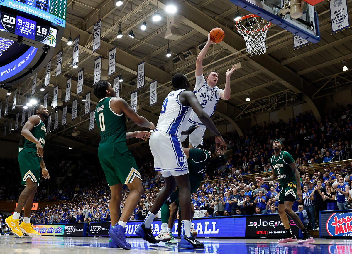 Duke’s Cooper Flagg is fouled by George Mason’s Jalen Haynes during the first half of the Blue Devils’ 68-47 win on Tuesday, Dec. 17, 2024, at Cameron Indoor Stadium in Durham, N.C.