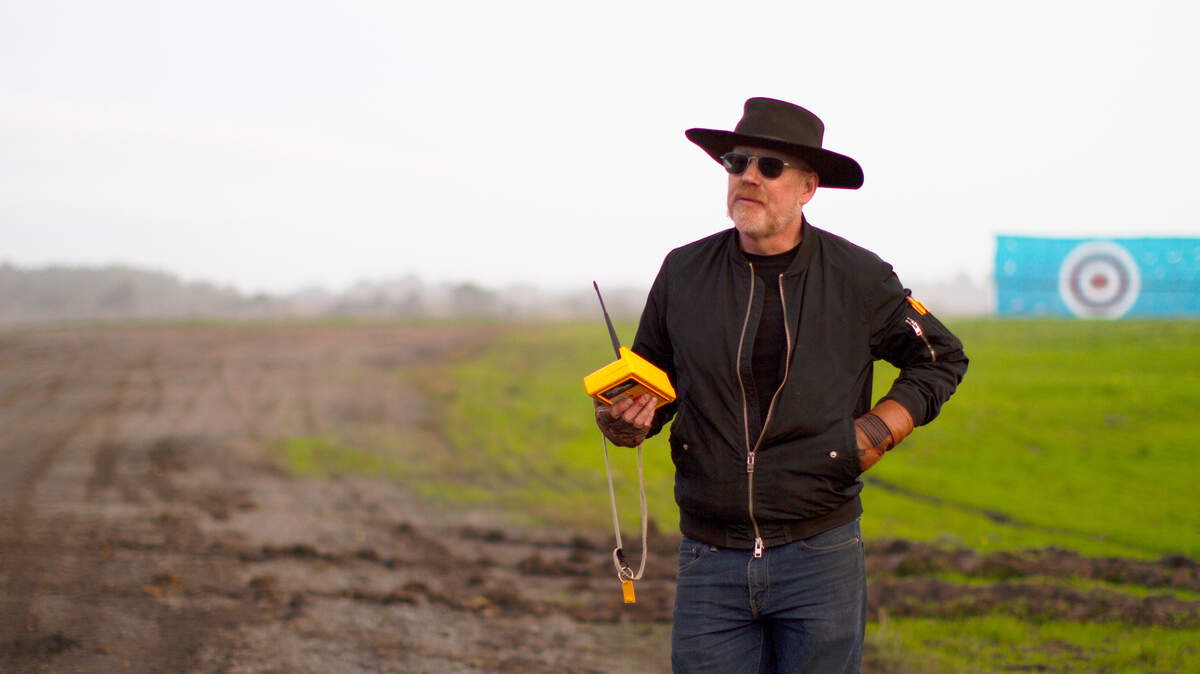 Adam Savage holds the remote controller, ready to launch the panjandrums first test during Season 1 of “Savage Builds” on the Science Channel.