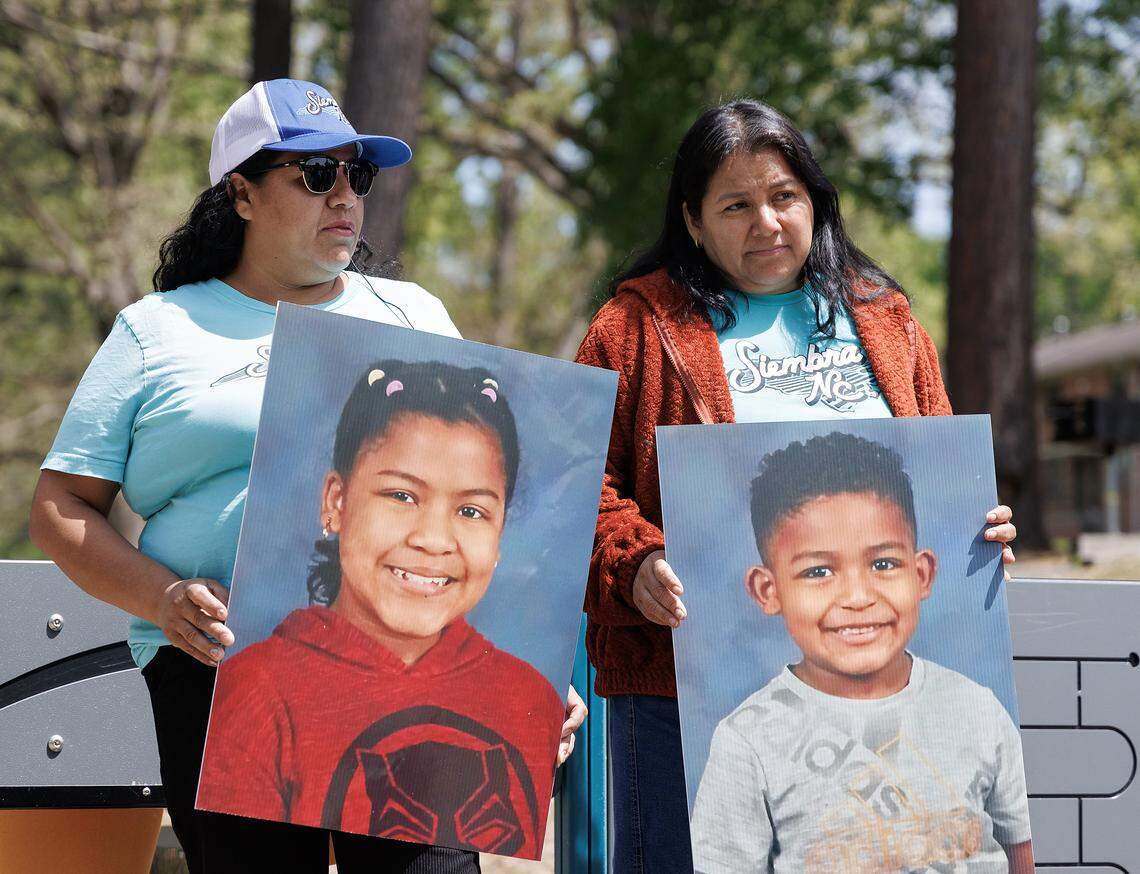 Reyna Gutierrez and Catalina Muñoz hold photographs prior to a press conference held in Durham, N.C. on Thursday, April 9, 2026, of Genesis, 11, and Denis, 6, Burton Elementary School students who were detained by ICE and deported.