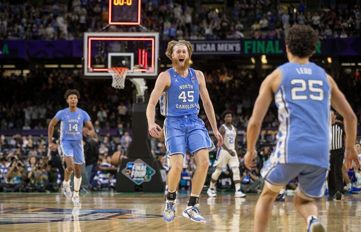 North Carolina’s Brady Manek (45) and his teammates celebrate their 81-77 victory over Duke as time expires during the NCAA Final Four semi-final on Saturday, April 2, 2022 at Caesars Superdome in New Orleans, La.