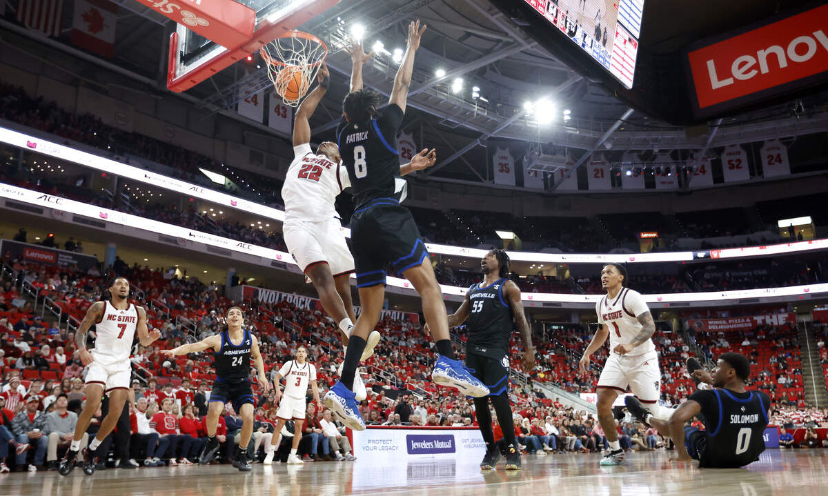 N.C. State's Ven-Allen Lubin (22) slams in two in the second half during N.C. State’s 75-63 victory over UNC Asheville at the Lenovo Center in Raleigh, N.C., Saturday, Dec. 6, 2025.