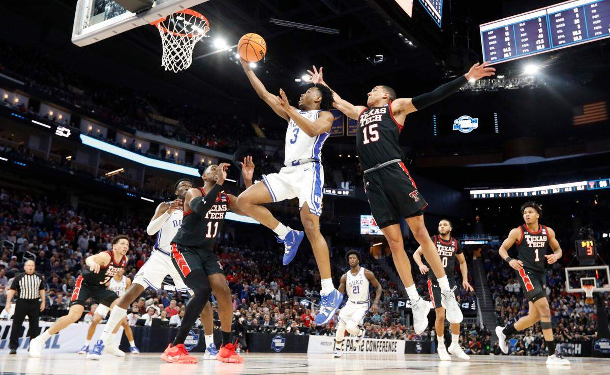 Dukes Jeremy Roach (3) drives to the basket as Texas Tech’s Kevin McCullar (15) defends during Dukes 78-73 victory over Texas Tech in the Sweet 16 round of the NCAA Tournament at the Chase Center in San Francisco, Calif., Thursday, March 24, 2022.