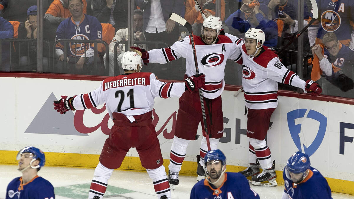 Carolina Hurricanes’ Jordan Staal (11) celebrates with Teuvo Teravainen (86) and Nino Niederreiter (21) as they celebrate their 1-0 overtime victory over the New York Islanders in Game 1 of the second round Stanley Cup series on Friday, April 26, 2019 at Barclays Center in Brooklyn, N.Y.