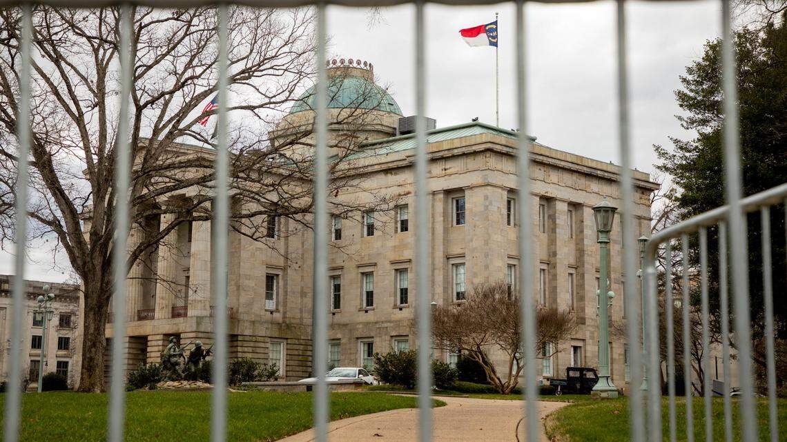 Metal gates surround the North Carolina State Capitol Building, on Monday, Jan. 18, 2021, in Raleigh, N.C.