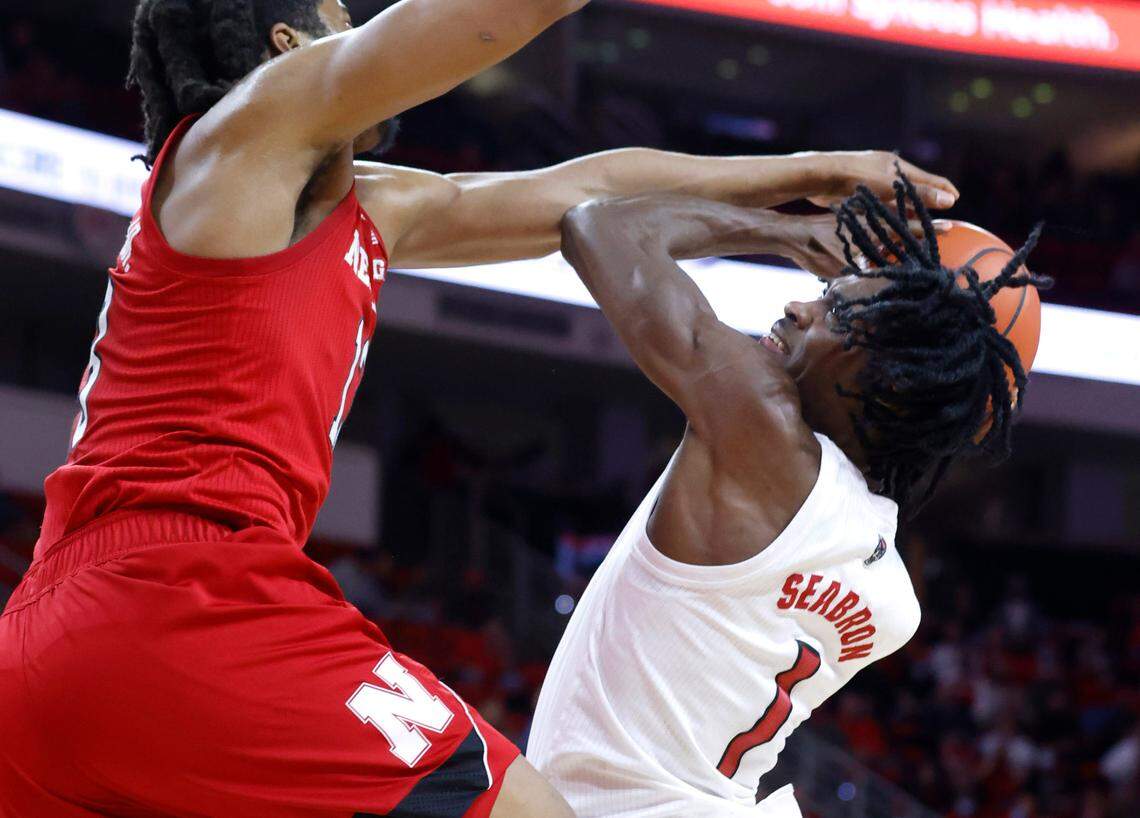 N.C. State’s Dereon Seabron (1) shoots while Nebraska’s Derrick Walker (13) defends during the first half of N.C. State’s game against Nebraska at PNC Arena in Raleigh, N.C., Wednesday, December 1, 2021.