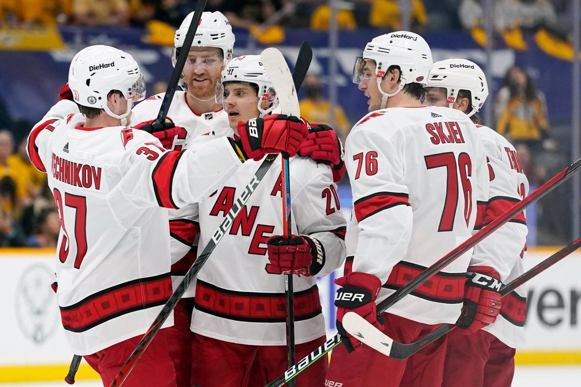 Carolina Hurricanes center Sebastian Aho (20) is congratulated by Andrei Svechnikov (37) after Aho scored a goal against the Nashville Predators during the first period in Game 3 of an NHL hockey Stanley Cup first-round playoff series Friday, May 21, 2021, in Nashville, TN.
