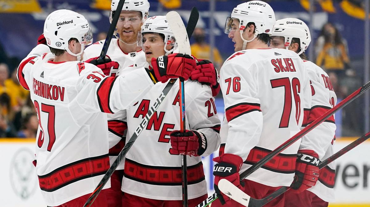 Carolina Hurricanes center Sebastian Aho (20) is congratulated by Andrei Svechnikov (37) after Aho scored a goal against the Nashville Predators during the first period in Game 3 of an NHL hockey Stanley Cup first-round playoff series Friday, May 21, 2021, in Nashville, TN.