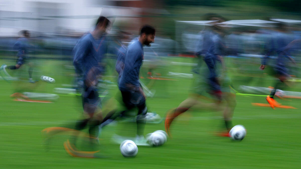 Iranian soccer players run during a training session at the 2018 World Cup in Moscow, Russia on Tuesday. The World Cup starts Thursday.