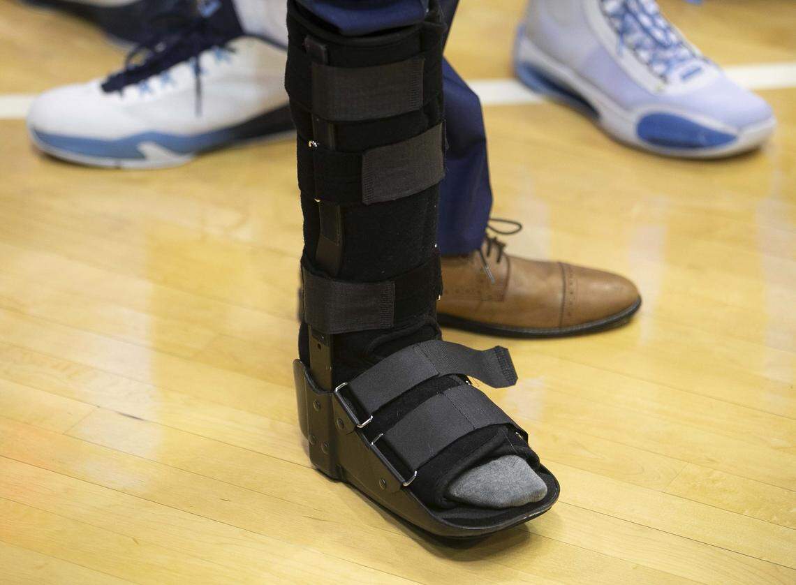 North Carolina’s Brandon Robinson, out with an injury to his ankle, wear a boot with his suit prior to the Tar Heels’ game against Notre Dame on Wednesday November 6, 2019 at the Smith Center in Chapel Hill, N.C.