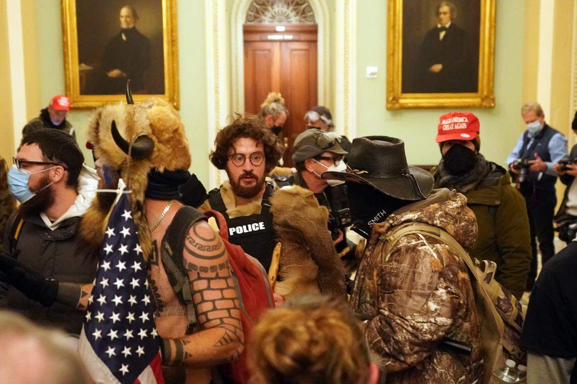 People protesting the presidential election results inside the Capitol in Washington on Wednesday, Jan. 6, 2020. Congress anxiously prepared for a marathon session on Wednesday to formalize President-elect Joe Biden’s Electoral College victory, after Republican loyalists to President Trump confirmed they would object to the results of at least three battleground states the Democrat won. (Erin Schaff/The New York Times)