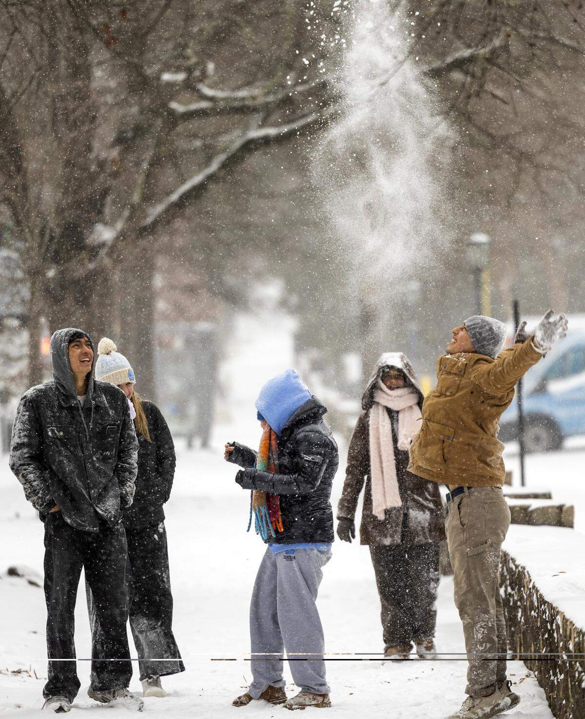 UNC-Chapel Hill students play in the snow along Franklin Street in Chapel Hill on Saturday afternoon, Jan. 31, 2026, as a winter storm brings snow and freezing temperatures to the region.