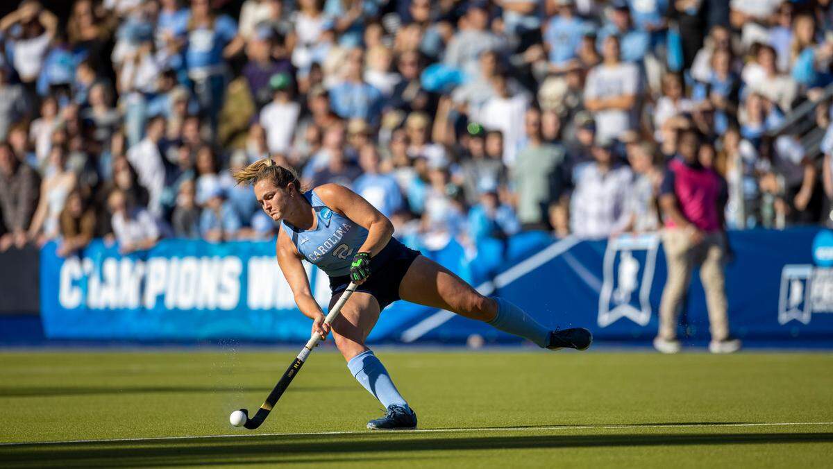 North Carolina’s Charly Bruner (2) moves the ball as a capacity crowd watches at Karen Shelton Stadium during the NCAA Division I Field Hockey Championship on Sunday, November 19, 2023 in Chapel Hill, N.C.