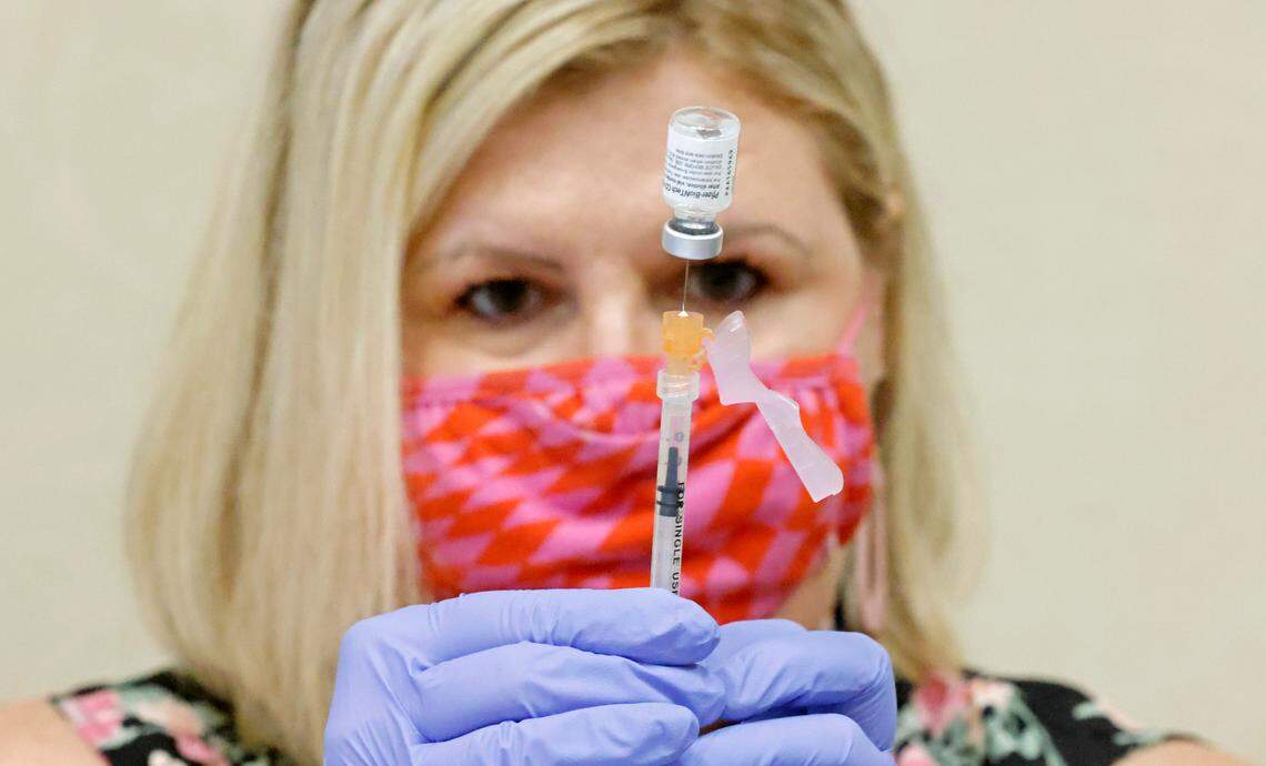 WakeMed pharmacist Michelle Cook prepares a Pfizer Covid-19 vaccine during the WakeMed Back-to-School Blitz vaccine clinic at the WakeMed Raleigh Campus in Raleigh, N.C., Sunday, August 1, 2021.