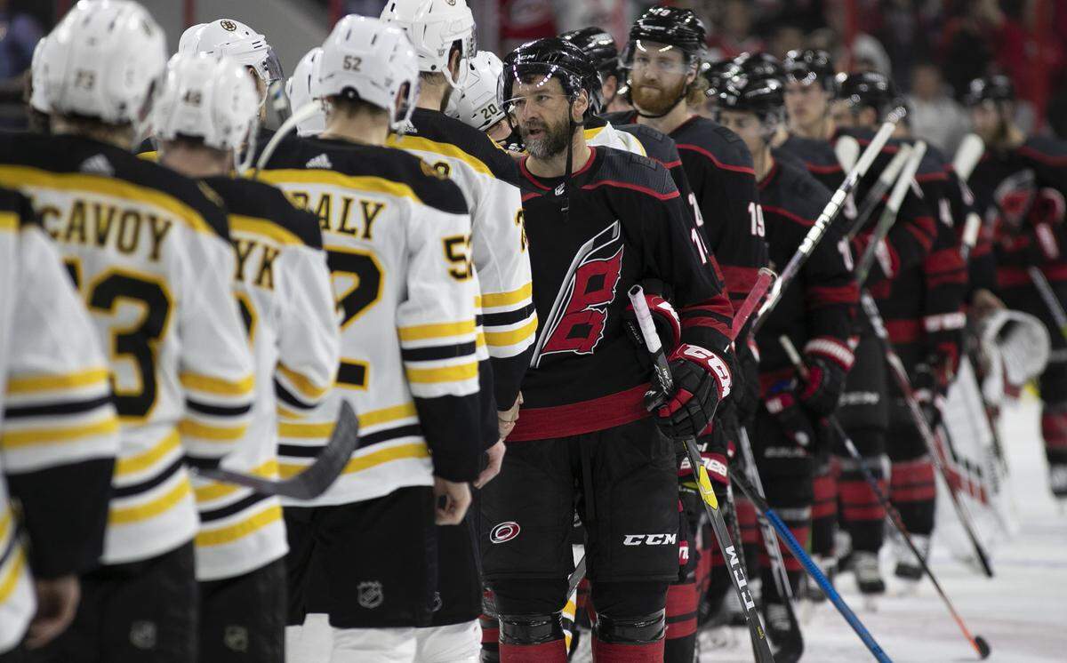 Carolina Hurricanes captain Justin Williams (14) works the handshake line with Boston Bruins after the Hurricanes fell 4-0, and Boston clinched the the Eastern Conference Championship on Thursday, May 16, 2019 at PNC Arena in Raleigh, N.C.