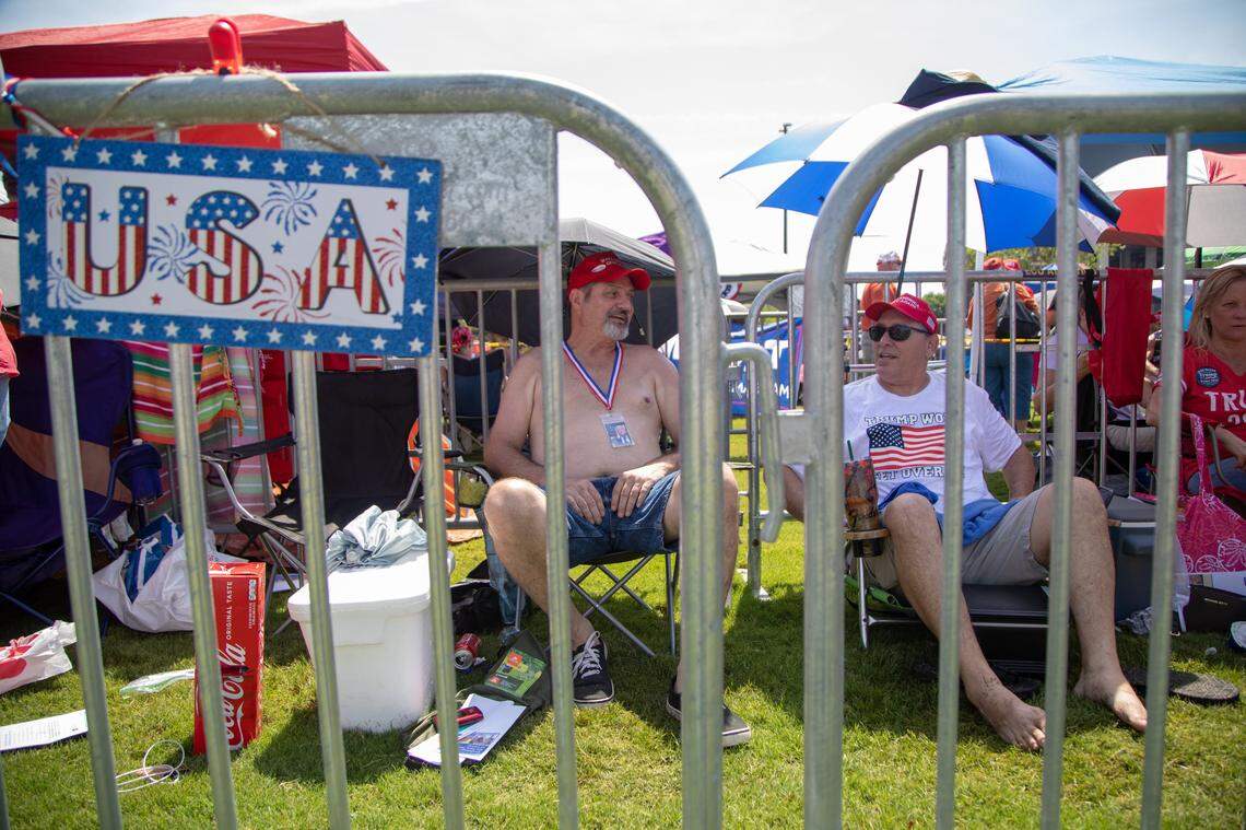 A man who identified himself as David from Tennessee, left, and Kelly Roberts of Kill Devil Hills wait in line to see President Donald Trump Wednesday morning, July 17, 2019 prior to a campaign rally at East Carolina University in Greenville, NC.