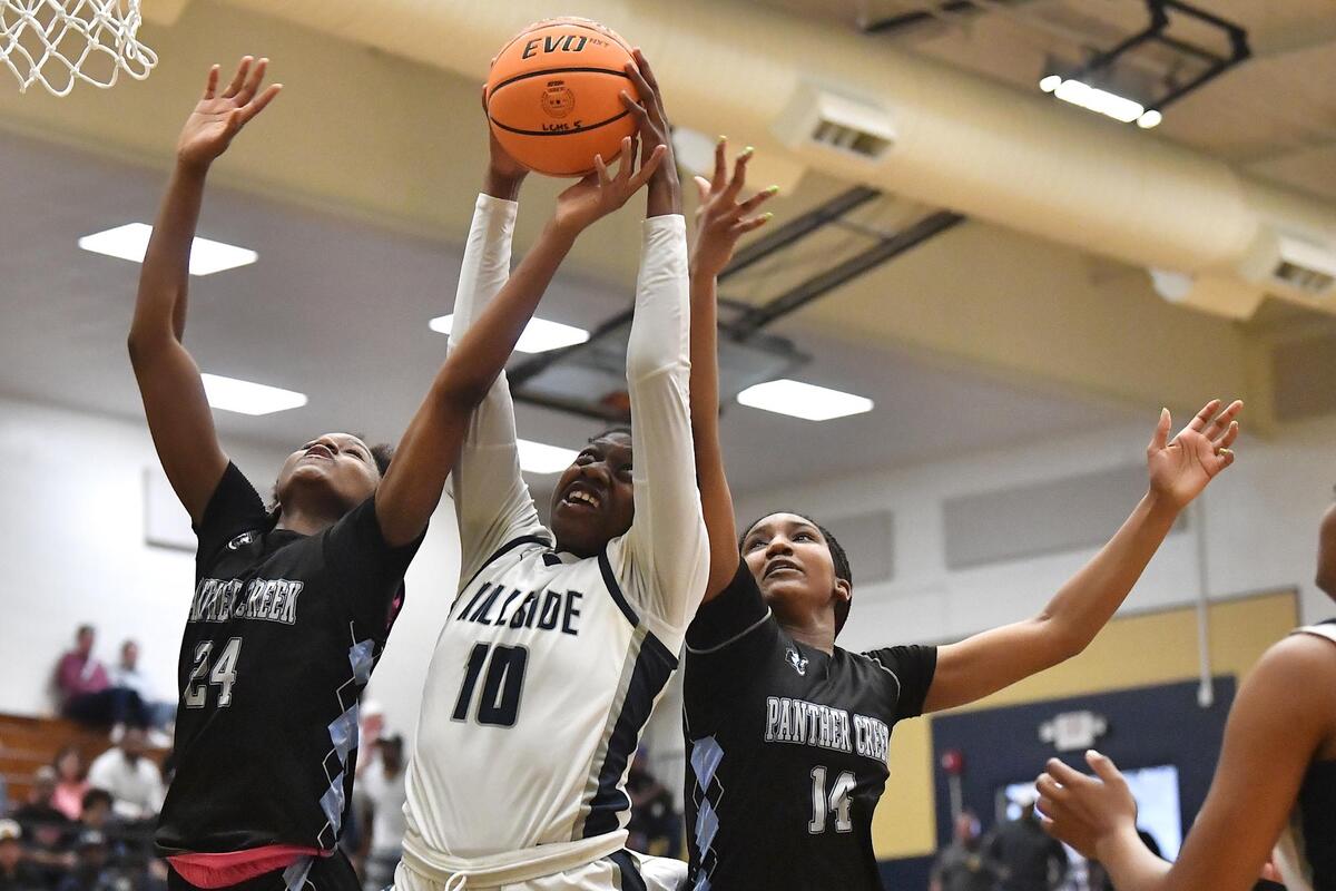 Hillside’s Dorinda Jordan (10) competes with Panther Creek’s Kirstin Smalls (24) and Madisyn Jordan (14) during the first half. The Hillside Hornets and the Panther Creek Catamounts met in the NCHSAA 4A East Regional Finals in Sanford, N.C. on March 4, 2023.