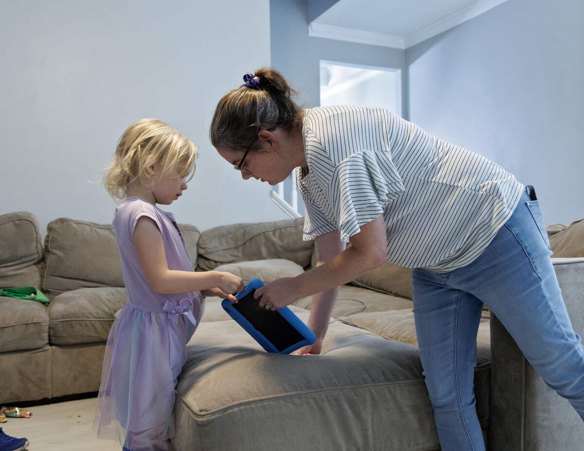 Brittany Futch talks with her daughter, Arya, 6, in Wake Forest. Futch is lobbying to get the Wake County school system to restore an aide’s position in Arya’s classroom at Heritage Elementary School. Arya has run away from her classroom multiple times since the aide was removed.
