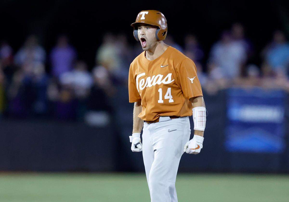Texas Murphy Stehly (14) celebrates after hitting a two RBI double in the second inning during ECUs game against Texas in the Greenville Super Regional at Clark-LeClair Stadium Sunday, June 12, 2022.